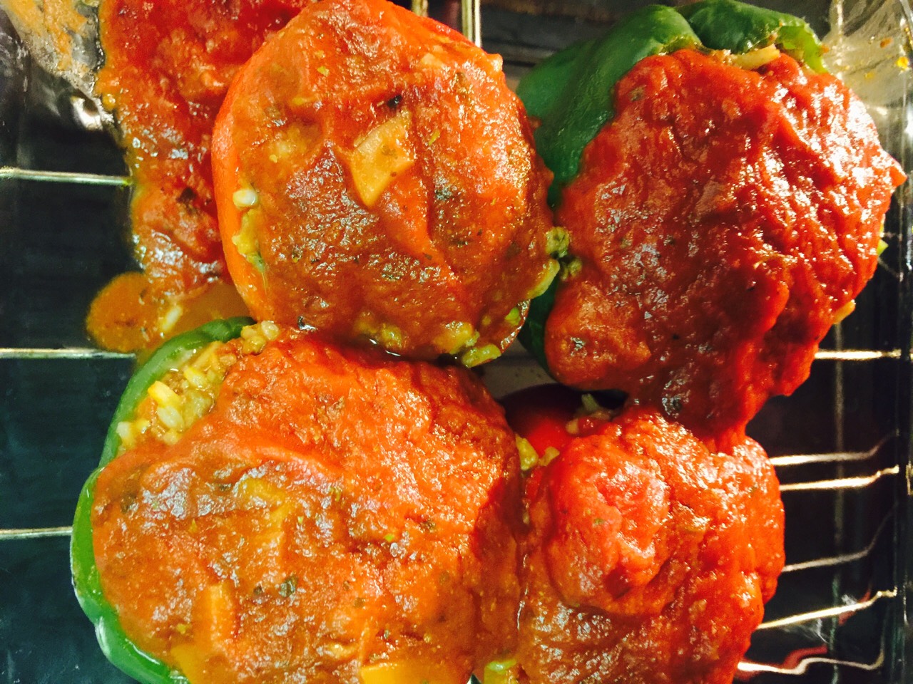 Meat mixture stuffed into pepper with 'extra' sauce poured over tops
