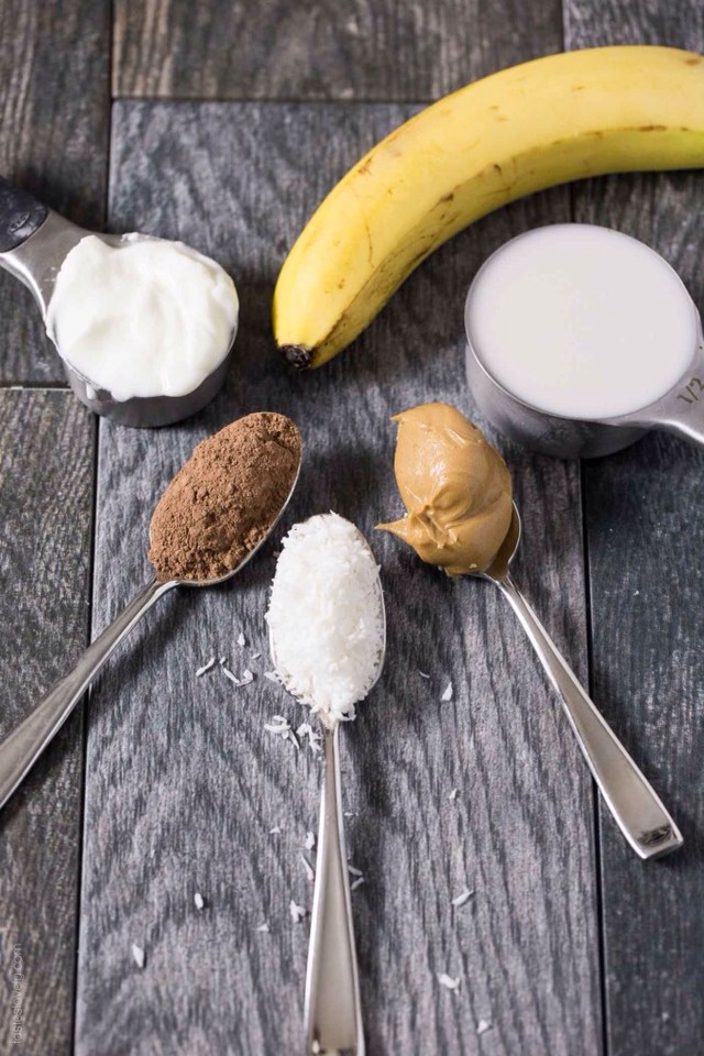 Ingredients
	•	1 cup ice
	•	¼ cup coconut flavored almond milk
	•	¼ cup Vanilla Lowfat Yogurt
	•	1 medium size banana
	•	2 tablespoons Peanut Butter
	•	2 tablespoons unsweetened coconut flakes
	•	1 tablespoon unsweetened cocoa powder. 