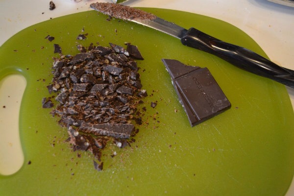 2) Cut up your chocolate bar. Cocoa powder can also be used for the chocolate component