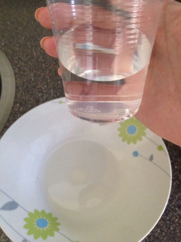 I prefer to use a shallow bowl that has a base about as wide as my hand. Get about a quarter to half cup of water and put it in the bowl (the clear cup is for your reference). Note: if you don't have enough water your eggs may explode in the microwave.