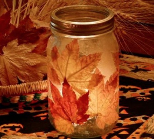 Beautiful candle holder! You can use leafs, pieces of thin paper, printed pictures or anything else. Lay it on a mason jar and paint it with glue. Makes a nice look on the uncovered parts as well. Use beads too! Be creative as can be!