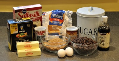 Preheat oven to 350 degrees. Cream together butter and sugar. Add eggs and vanilla. Beat in the flour, baking soda and salt. Fold in the chocolate chips and m&ms or nuts (optional). Drop by spoonfuls onto a baking sheet and bake for 10 - 12 minutes or golden brown.