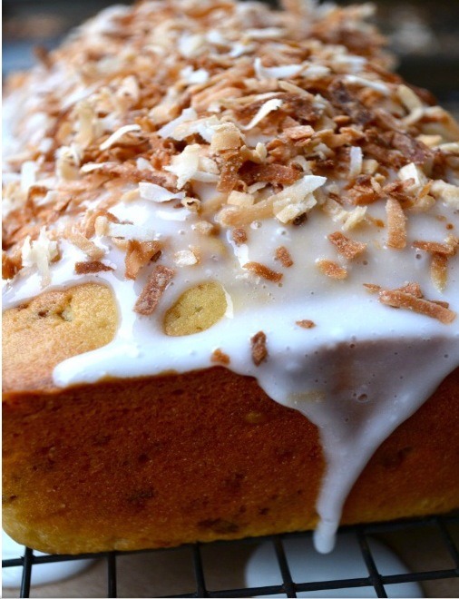 Whisk together confectioners' sugar and remaining 2 tablespoons buttermilk. Drizzle over cake and sprinkle with remaining 1/4 cup coconut.