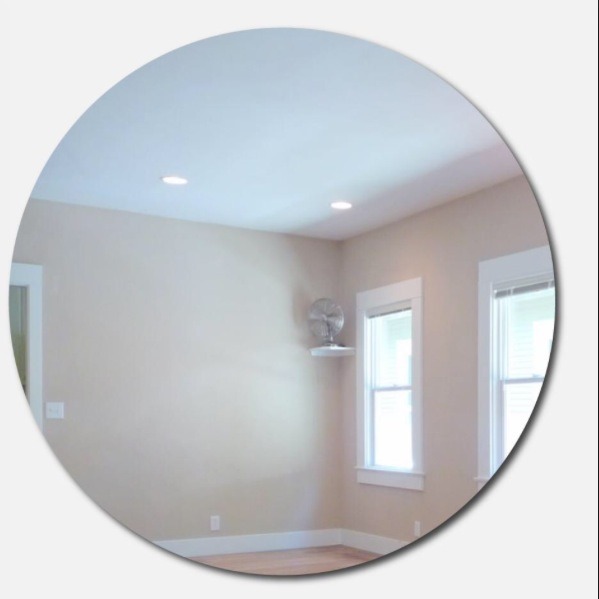 At this point you'll want to glue your mirror onto the cardboard so that you can follow the outline of the mirror. And begin glueing the spoons soon.