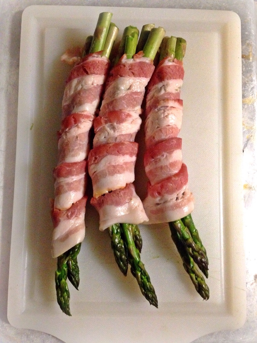 Wrap every 3 asparagus spears with 1 piece of bacon. You can play with this ratio if you'd prefer more bacon to asparagus or to fit your ingredient needs.