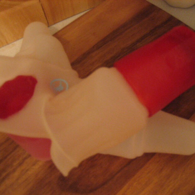 To remove the gummi shots from the mold, you'll need to basically invert the silicone of each section (as shown). Don't worry about tugging too hard, it's pretty hard to rip the gummy, but it can get a little distorted
Store in a small container in the freezer until you want to use them