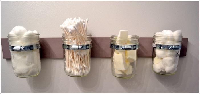 A few mason jars and a wooden panel = a stylish (and practical) way to store cotton balls and makeup sponges.