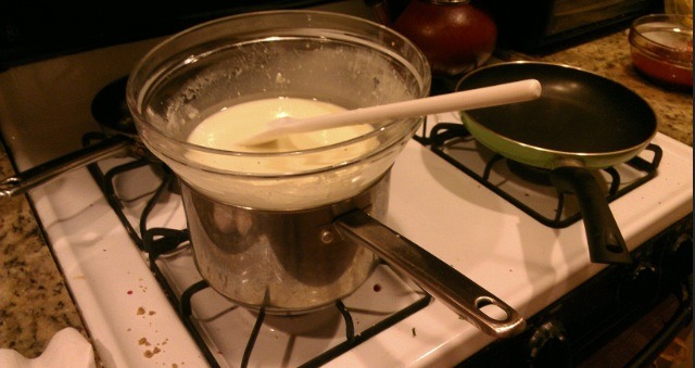 Step 2. 
Melt The Chocolate 
Put the semisweet and white chocolates into 2 separate heatproof medium bowls. Fill 2 medium saucepans with a couple inches of water and bring to a simmer over medium heat. Turn off the heat; set the bowls of chocolate over the water to melt. Stir until smooth. 
