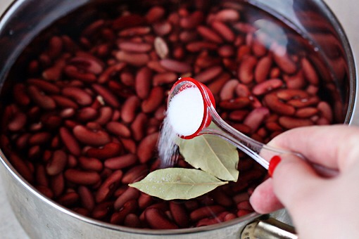 4. Then add 2 bay leaves and 1/2 teaspoon of salt.
5. Bring to a boil, reduce heat to a low simmer, cover and let cook for about 1 hour and 15 minutes or until beans are tender.
6. When the beans are cooked remove the bay leaves.