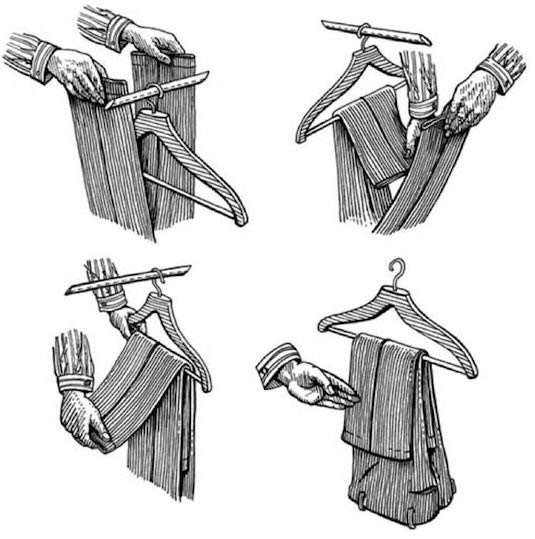 25. Hang Pants Like a Pro
This is a smart way to hang your pants if you have a problem with them slipping off of the hanger. Just straddle the hanger with your pants upside-down, and fold one leg at a time through the hanger so that the second leg is resting on top of the first.
