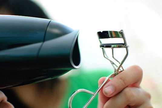 14. Heat Your Lash Curler
Hold a blow dryer up next to your lash curler for about 3-5 seconds. The heat works the same way as it does with your curling iron, giving you those flirty lashes that will last all day.