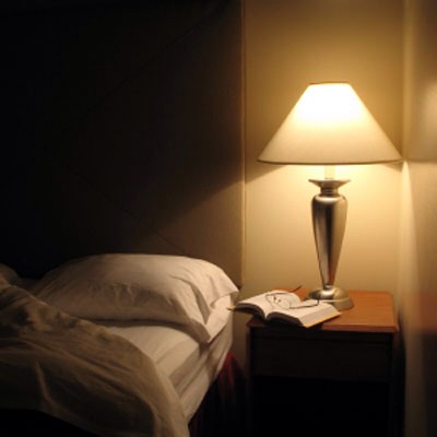Set the mood for slumber! Keeping your room dark while you sleep is a great start, but bringing the lights down before bed is also important.