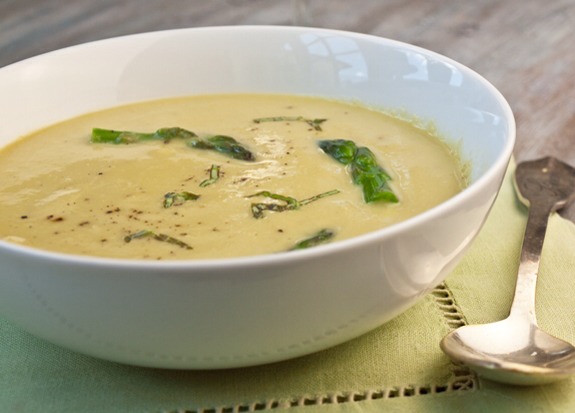Finally, ladle the soup into bowls and top with the asparagus tips, fresh herbs, more Parmesan cheese, and freshly ground black pepper if desired.