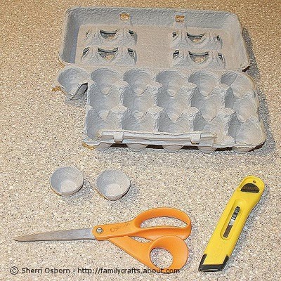 Use the scissors or utility knife to cut two cup sections from the egg carton. Trim to create an even edges around the cups. Adults should help kids with this step.