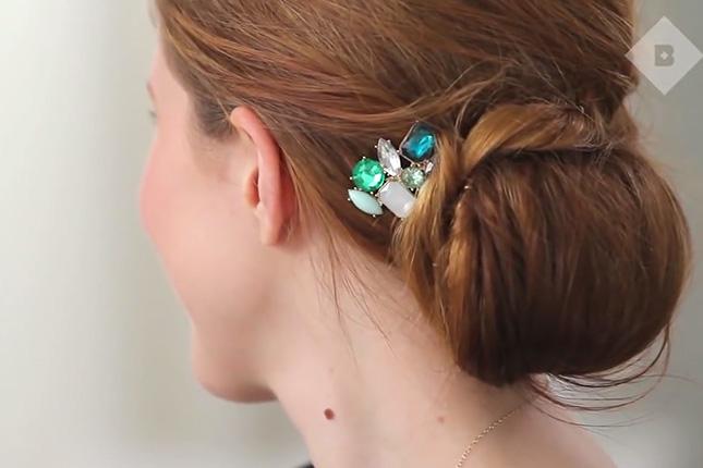 2. Elegant Holiday Updo: Amp up a classic updo with an elegant gemstone hairpin. This chic, yet slightly messy style is a great way to camouflage second day hair. (via InStyle)
 