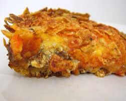 Brown ground beef/turkey, add taco seasoing according to directions on packet.
Crush the entire bag of Doritos. Cover the bottom of the casserole dish with the crushed Doritos. Add the ground beef. Add 2/3 of the cheeses (mixed),add lettuce, tomatoes and remainder of cheese.