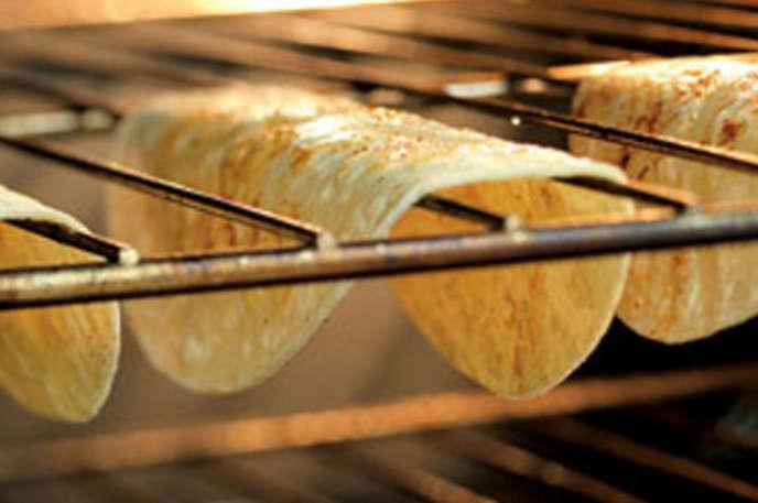 Make your own stand-up taco shells:
Put tortillas on oven racks at 375 degrees for 8-10 minutes for homemade crunchy tacos that won't fall over.