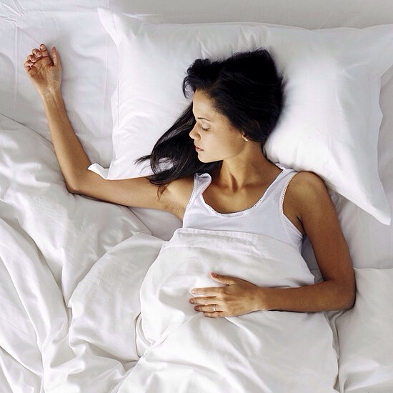 2. Sleep on your back. 
Speaking of wrinkles,sleeping on your back can help nip them in the bud before they even start to form.Repeated pressure on the skin,causing creasing,can eventually lead to set-in line.A person who sleeps on one side may even have more set-in wrinkles on that particular side.