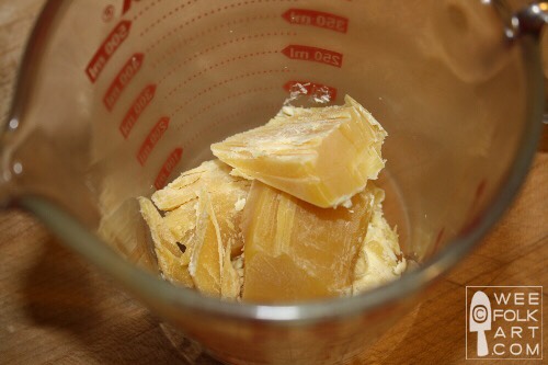 While the water is heating up, chop up two tablespoons of beeswax...