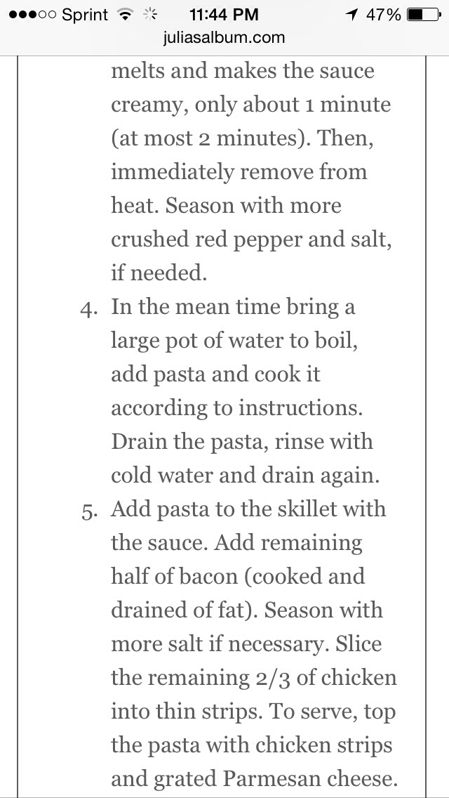 Chicken and bacon pasta with spinach and tomatoes in garlic cream sauce