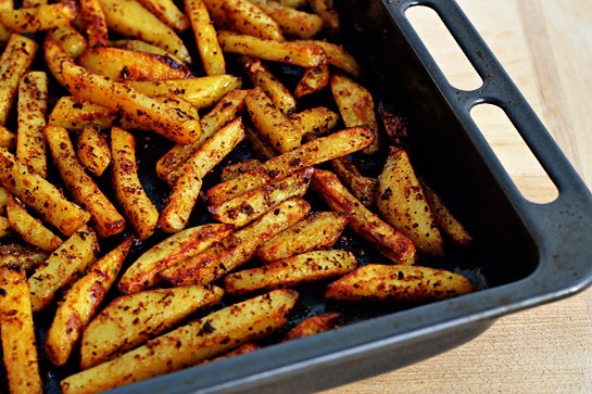 14. Bake in the preheated oven (430 F – 220 C) for about 40 minutes.

To make sure that your fries will keep their nice shape and will not break, move them around (using a spatula) every 5-7 minutes.

I also sprinkled my fries with a little bit of additional vegetable oil while they were baking.