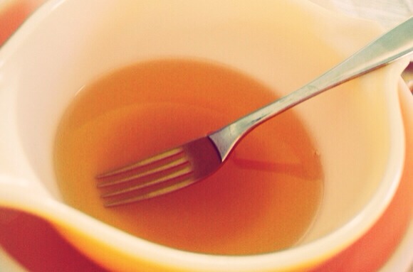Place oil, beeswax and honey in a double boiler (or heatproof bowl resting on top of a small saucepan of simmering water). (As a side note, I picked up an extra double boiler thrifting that I use just for beeswax crafts, which really makes cleanup easier.) Heat gently until everything has melted.
