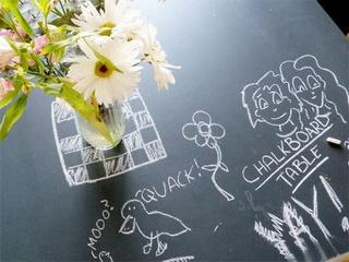 Spice up a thrifted table with some chalkboard paint . Use it to jot down your creative whims, phone numbers, to-do lists, or doodles! 
