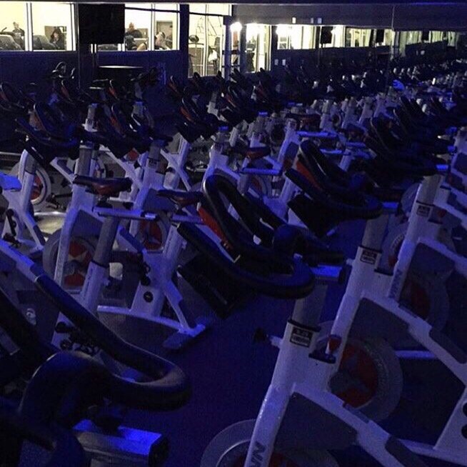 1. Get to the class 15-20 minutes early to talk to the instructor

I go to 24 hour fitness and this is actually the room in the picture. But when I first went I got there before everyone else so I could have a one on one conversation. She helped me set up my bike and walked me through what to expect