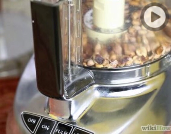 Begin by removing the shells from peanuts.
Chop peanuts in food processor continuously for 2 to 3 minutes or until the mixture forms a ball.
