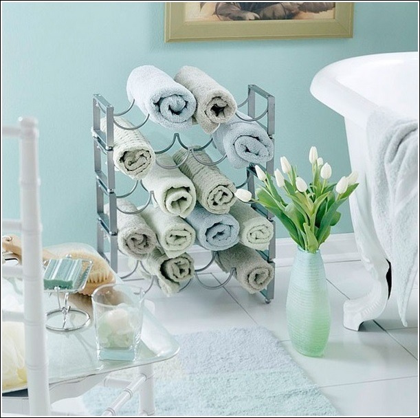 Use an old wine rack for easy storage of towels 