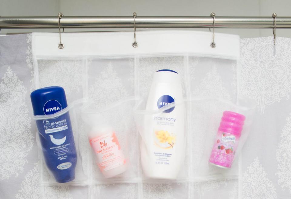 2. Hang a mesh over-the-door shoe organizer on the inside of your shower curtain to hold your products. This is a great hack to finally clear the space around your bathtub ledge.