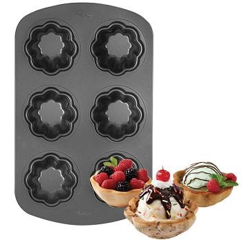 Try to make sure that the bowls aren't too thick or close together on the muffin pan. Bake for 10 to 15 minutes, until golden brown. Let cool before you put ice cream in.