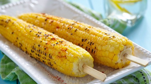 Corn On The Cob
Though there are certainly less starchy veggies out there, this summertime favorite makes the bikini-friendly list because it’s high in fiber and one of the lowest calories items you’ll find on a typical outdoor barbecue menu