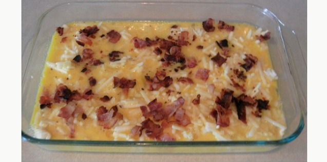 Spread shredded hash browns over the dough. 
Beat eggs in a bowl, salt and pepper to taste, and spread over the hash browns.
Crumble up bacon and sprinkle over the eggs. 
Bake in oven at 350 degrees for 40-45 minutes. 