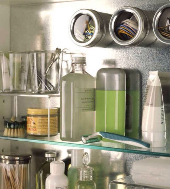 Those magnetic spice canister thingies can be used in the bathroom to store tiny things like bobby pins and hair ties!