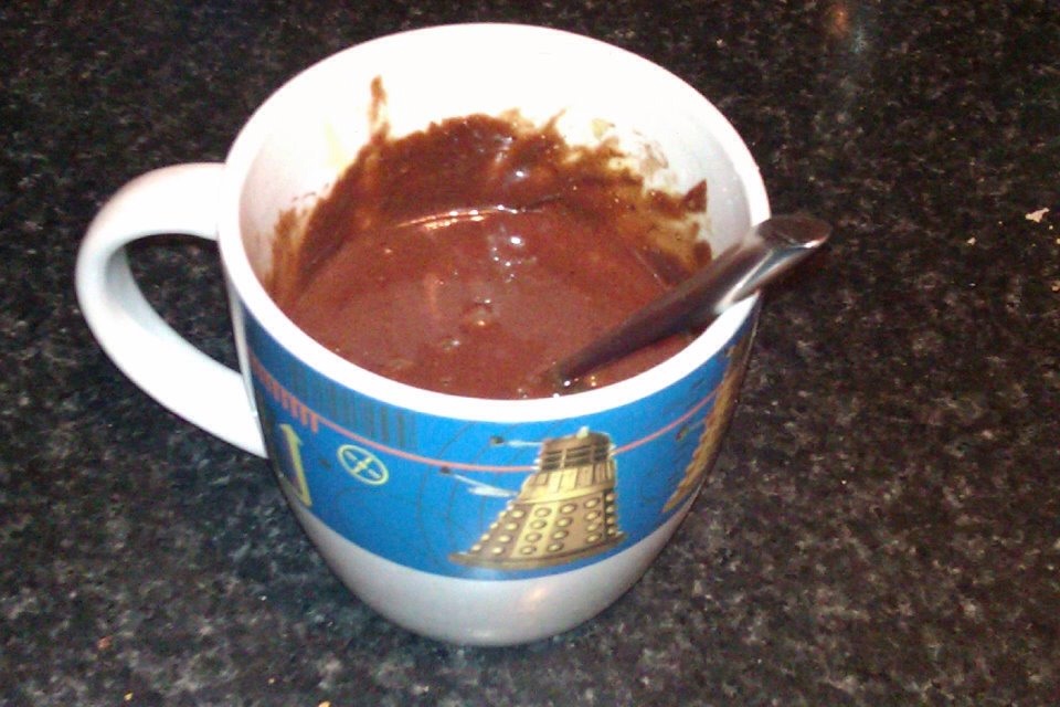 Put all ingredients in to mug, mix well! Microwave for about and minute and a half, this will keep the bottom slightly runny. The longer you cook it the more solid it becomes 
 