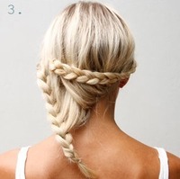 3. Take one of the braids and pin it up horizontally with bobby pins.
