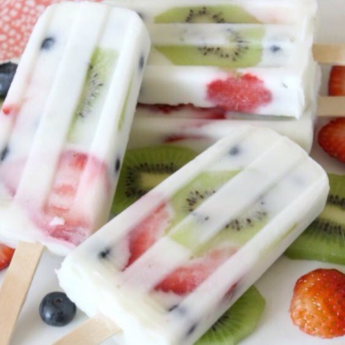 Pour yogurt and fruit slices into Popsicle molds to create these healthy ice lollies