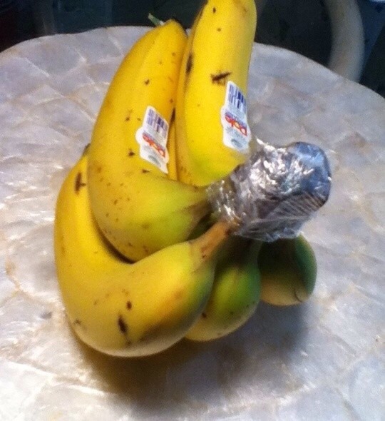 Wrap the crown of a bunch of bananas with plastic wrap.
They'll keep for 3-5 days longer than usual, which is especially helpful if you eat organic bananas. Bananas also produce more ethelyne gas than any other fruit, so keep them isolated on the counter.
