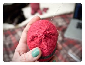 5.Hand stitch the head closed and then do the same to the neck of the body