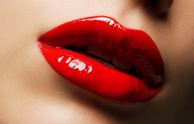If you were going for the super shiny red lip. Then apply your lipstick first,the translucent powder next, and lastly put on a CLEAR gloss. That way if its the gloss that smears, it'll be an easy fix since your color won't be smeared, just a little bit of shine. 