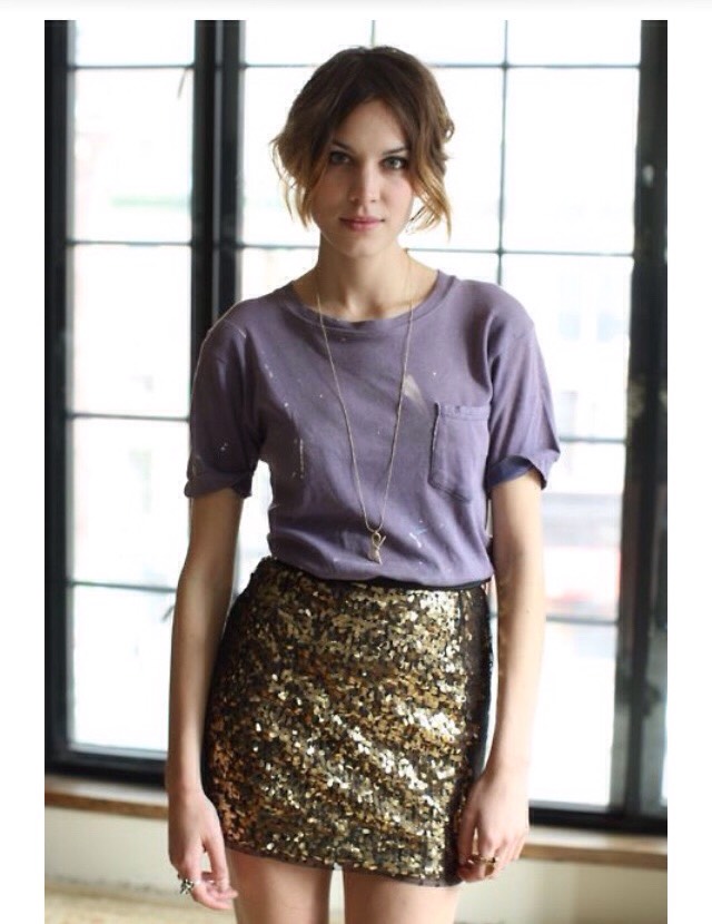 25. A modern trick to looking like the most effortlessly stylish girl in the room: Pair dressy bottoms (a velvet maxi, a leather or beaded skirt, silk pants) with a worn gray crew-neck sweatshirt or T-shirt.