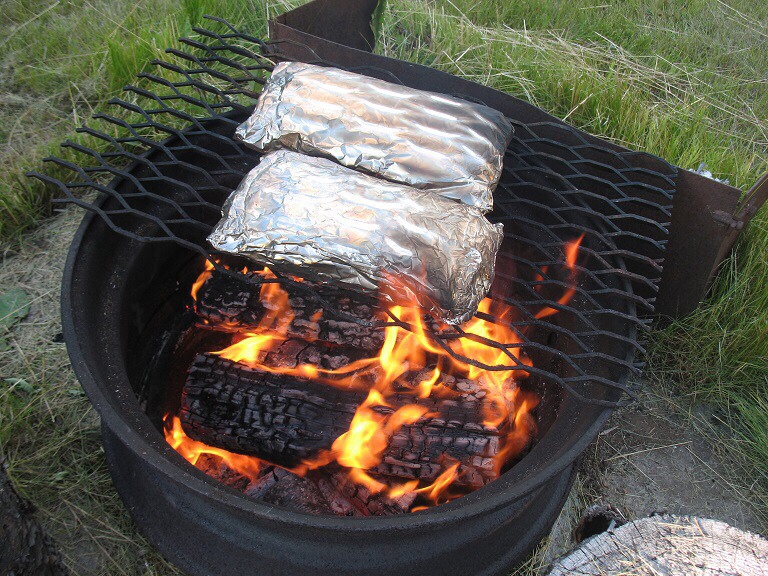 Reheat on your fire pit to save time in the morning while camping.