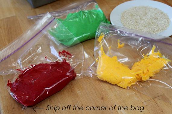 divide the frosting into 3 colored portions and put them in ziplock bags or decorating bags with a small cut on the corner. the colors are yellow, red and green