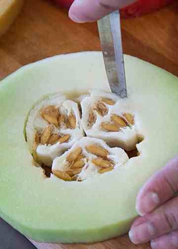 Remove the seeds from the cantaloupe and honeydew. Set melon slices aside.