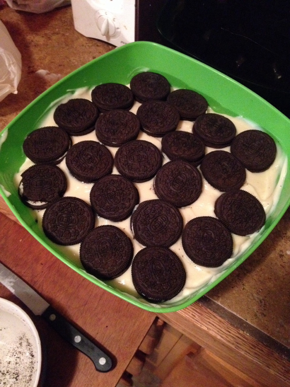 At the very end, put your last layer of pudding and top it with whole Oreos. 