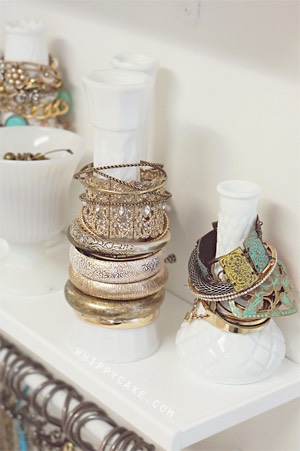Inexpensive vases (that can be found in abundance at thrift stores!) are used to hold bracelets!