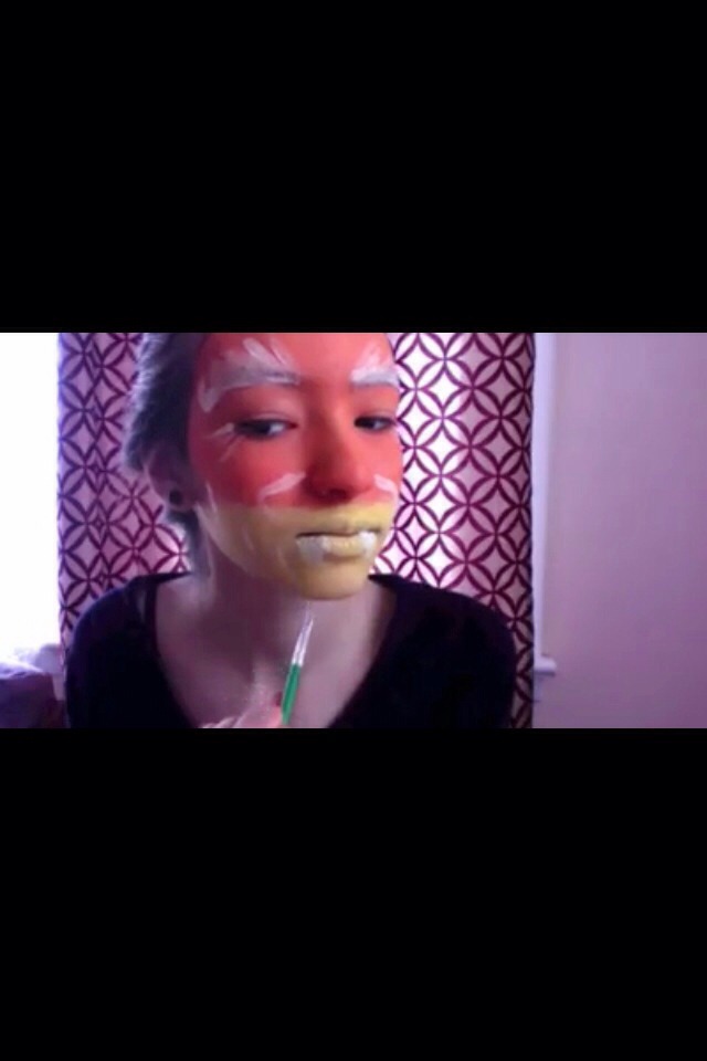 Can't see it too well, but paint three white stripes on each side of the face :)