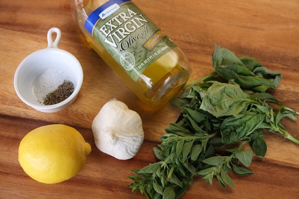 Lemon-Garlic Herb Rubbed Chicken

•1 1/2 tsp finely pressed garlic
•1 large or 2 small lemons, zested,juiced
•1/3-1/2 cup minced fresh herbs, preferably a combo of basil, rosemary,oregano
•1 tsp kosher salt
•1/4 tsp black pepper
•5-7 tsp extra virgin olive oil
•1 1/2-2lb bone&skinless chicken breast