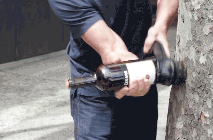 3. Hit the heel of the shoe against a hard vertical surface. The shoe will cushion the bottle while the pressure from the blows forces the cork out.